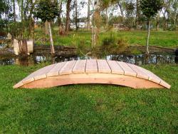 This simple but nice 6 foot plank bridge is on its way to koi pond located in Exuma ,Bahamas.