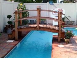 9 foot step bridge over a lap pool in NY 
